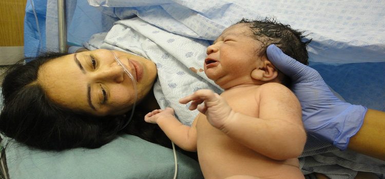mother and newborn in delivery room