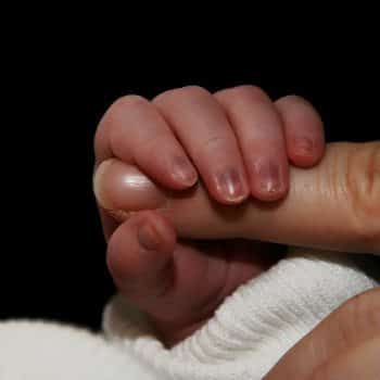 newborn gripping finger