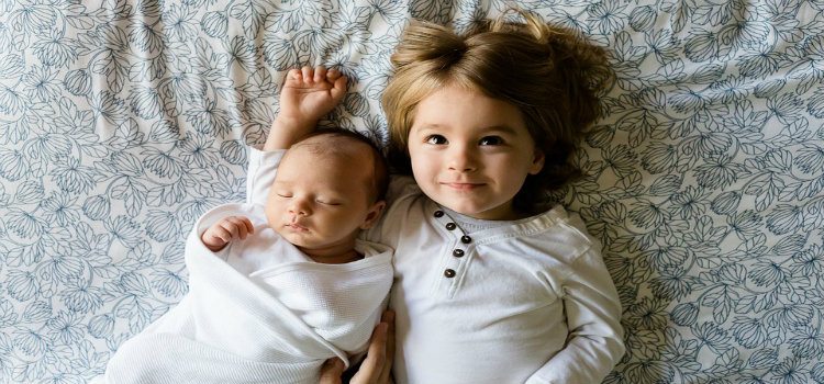 toddler and newborn siblings