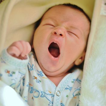 yawning infant